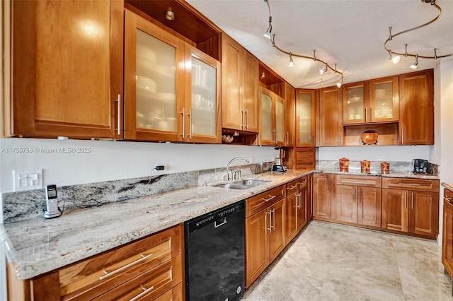 1201 S Ocean Dr Unit 1711S, Hollywood, FL 33019 - kitchen with black dishwasher, brown cabinetry, glass insert cabinets, a sink, and light stone countertops