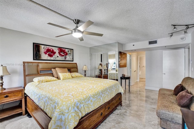 1201 S Ocean Dr Unit 1711S, Hollywood, FL 33019 - bedroom with baseboards, visible vents, a ceiling fan, a textured ceiling, and a closet