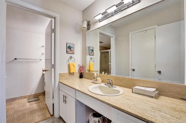 1201 S Ocean Dr Unit 1711S, Hollywood, FL 33019 - full bath featuring a stall shower, baseboards, and vanity