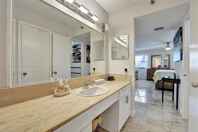 1201 S Ocean Dr Unit 1711S, Hollywood, FL 33019 - ensuite bathroom with baseboards, ceiling fan, ensuite bathroom, a textured ceiling, and vanity