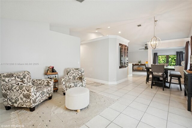 living area with light tile patterned floors, baseboards, visible vents, vaulted ceiling, and a notable chandelier