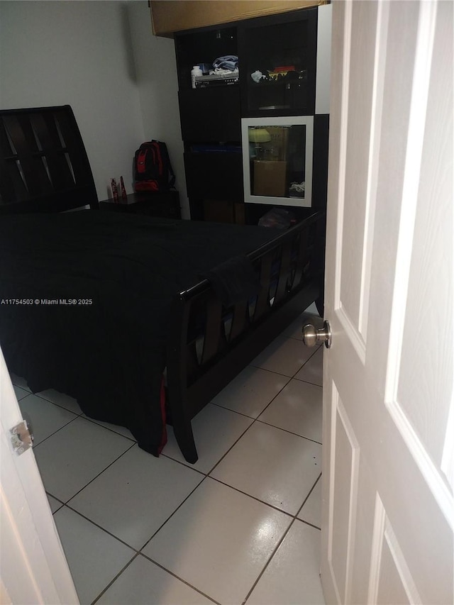 bedroom featuring tile patterned flooring