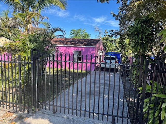 view of gate with fence