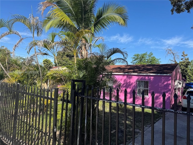 view of gate with a fenced front yard