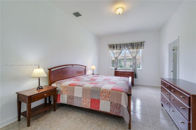 bedroom with light tile patterned floors, baseboards, and visible vents