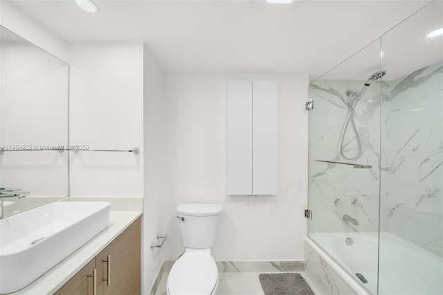 bathroom with toilet, vanity, baseboards, marble finish floor, and combined bath / shower with glass door