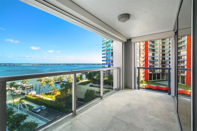 balcony featuring a water view