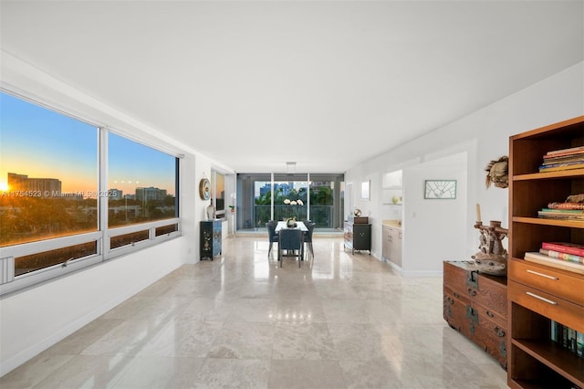 interior space featuring baseboards