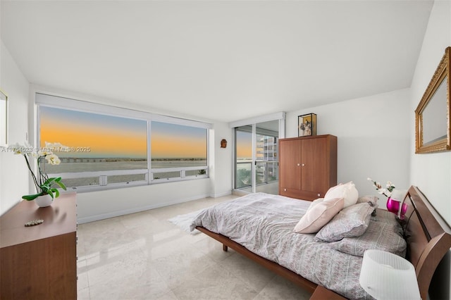 bedroom featuring baseboards