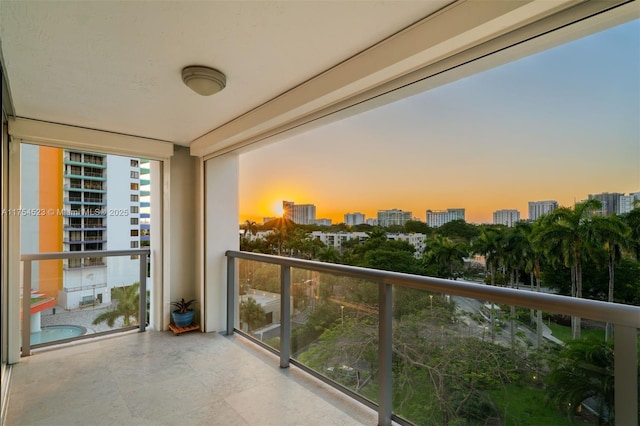 balcony at dusk with a city view