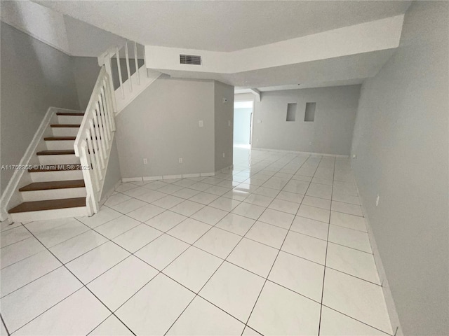 5790 W 26th Ave Unit 202, Hialeah, FL 33016 - below grade area with light tile patterned floors and stairs