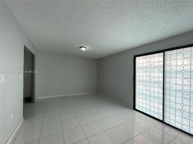 5790 W 26th Ave Unit 202, Hialeah, FL 33016 - spare room featuring a textured ceiling