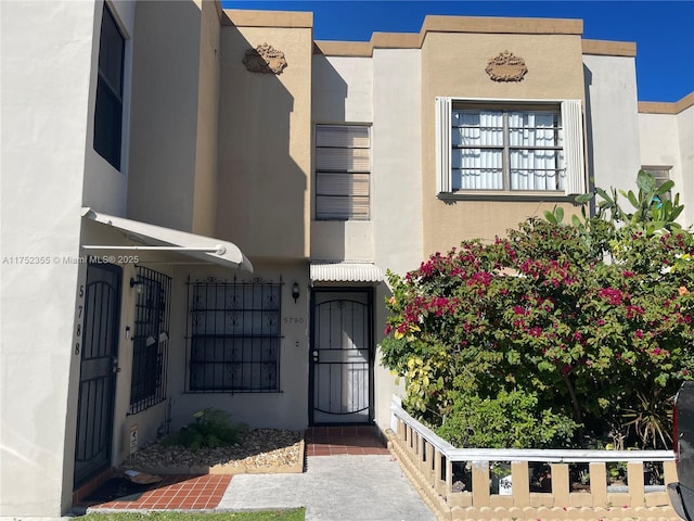 5790 W 26th Ave Unit 202, Hialeah, FL 33016 - doorway to property with stucco siding
