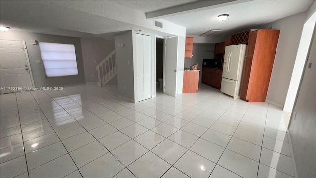 5790 W 26th Ave Unit 202, Hialeah, FL 33016 - unfurnished room featuring stairway, light tile patterned floors, and a textured ceiling