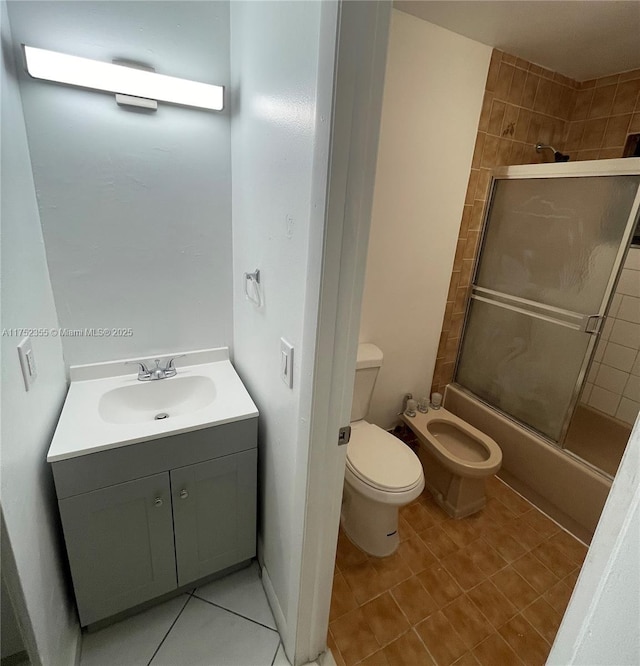 5790 W 26th Ave Unit 202, Hialeah, FL 33016 - bathroom featuring combined bath / shower with glass door, vanity, and tile patterned floors
