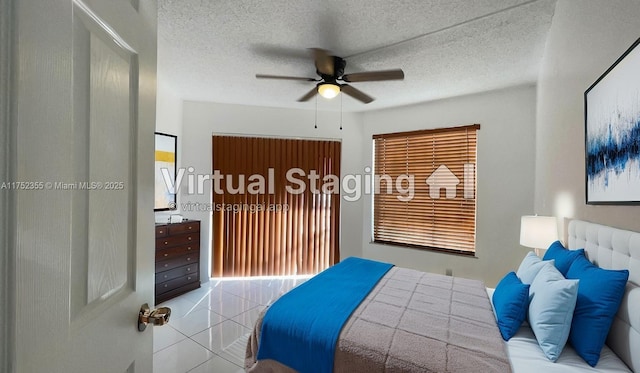 5790 W 26th Ave Unit 202, Hialeah, FL 33016 - tiled bedroom with multiple windows, a textured ceiling, and a ceiling fan