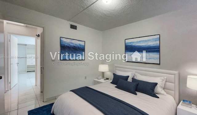 5790 W 26th Ave Unit 202, Hialeah, FL 33016 - bedroom featuring tile patterned floors and a textured ceiling