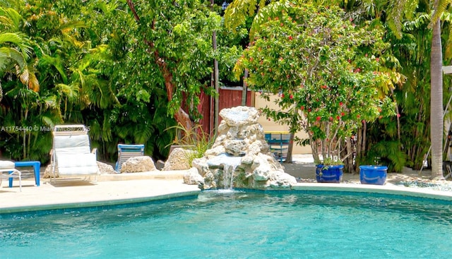 view of pool featuring fence, a fenced in pool, and a patio