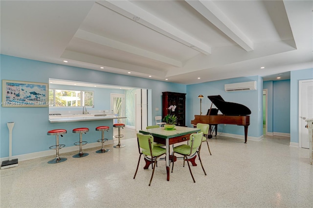 playroom with light speckled floor, recessed lighting, lofted ceiling with beams, a wall mounted air conditioner, and baseboards