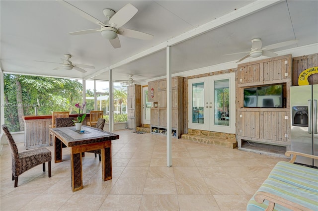 sunroom / solarium featuring french doors