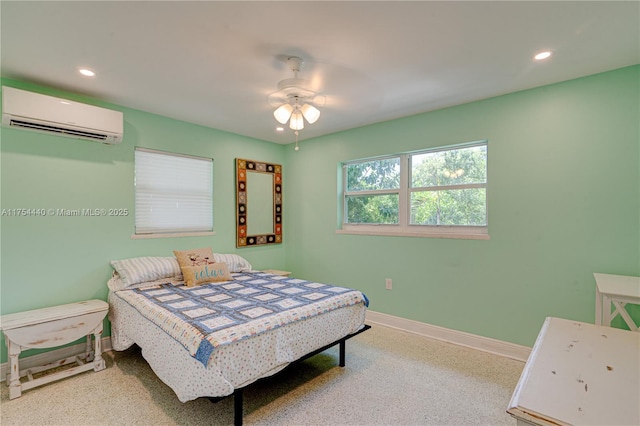 bedroom featuring ceiling fan, recessed lighting, a wall mounted air conditioner, and baseboards