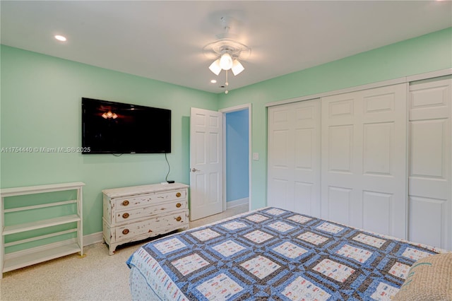 bedroom with recessed lighting, a closet, ceiling fan, and baseboards