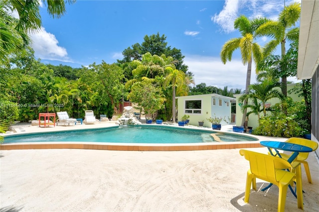 pool with an outdoor structure and a patio