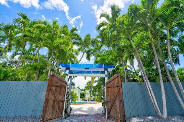 view of gate with fence