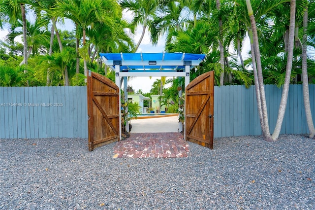 view of gate featuring fence