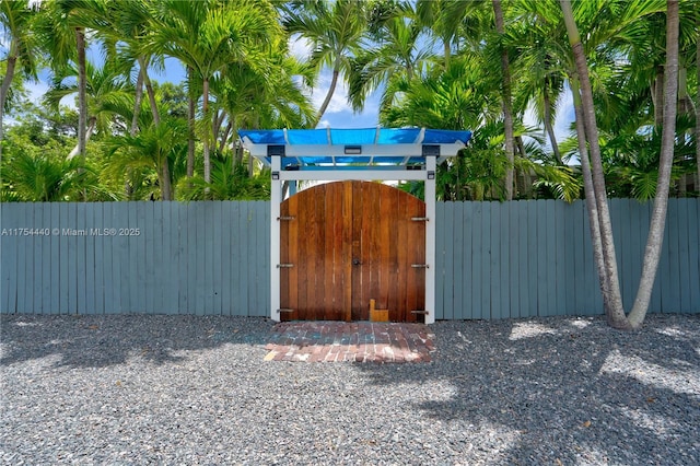 view of outbuilding with a gate and fence