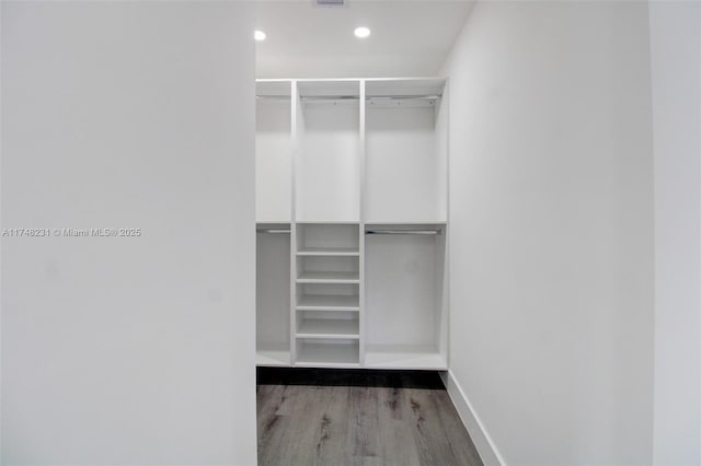 spacious closet with wood finished floors