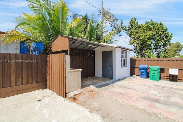 view of outdoor structure with fence and an outdoor structure