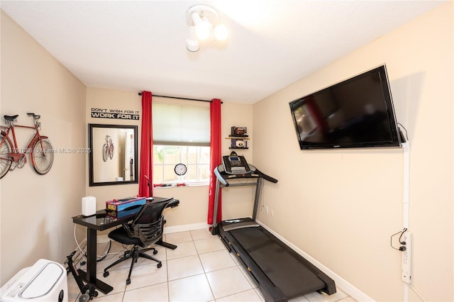 office space with light tile patterned flooring and baseboards