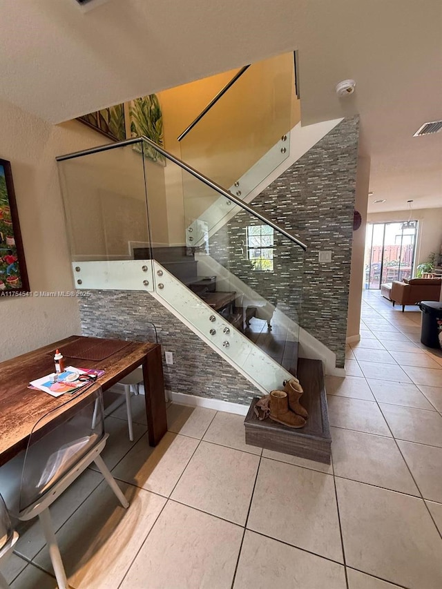 interior space with tile patterned flooring and visible vents