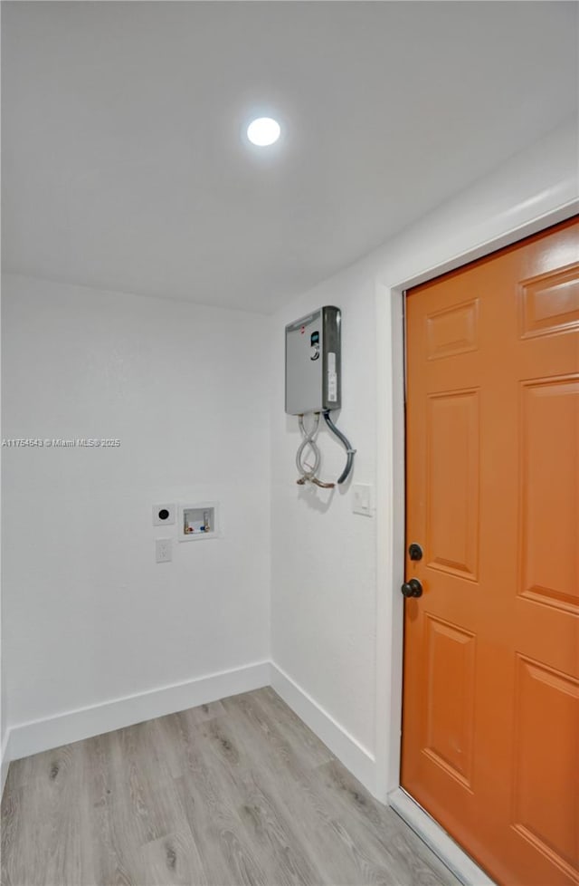 laundry area with hookup for a washing machine, light wood-style flooring, hookup for an electric dryer, laundry area, and baseboards