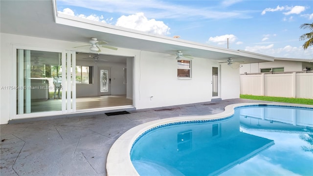 view of pool featuring a patio, fence, a ceiling fan, and a fenced in pool