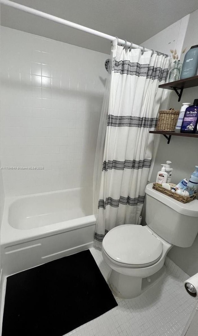 bathroom with tile patterned flooring, toilet, and shower / tub combo with curtain