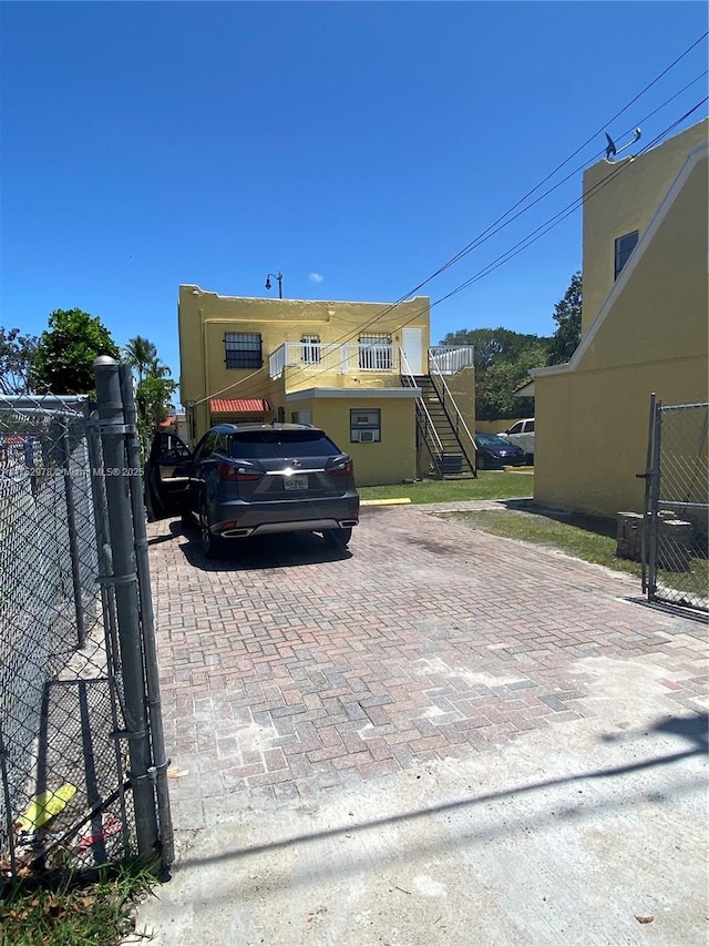 exterior space with fence and stairs