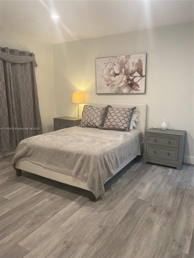 bedroom featuring wood finished floors