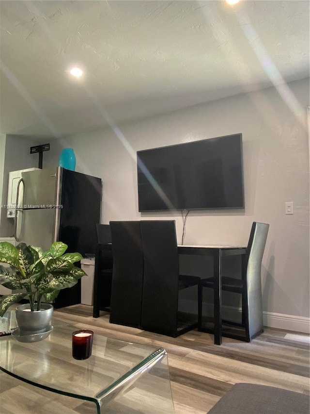 dining area with wood finished floors, baseboards, and recessed lighting