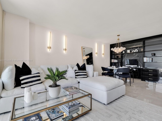 living area featuring a chandelier