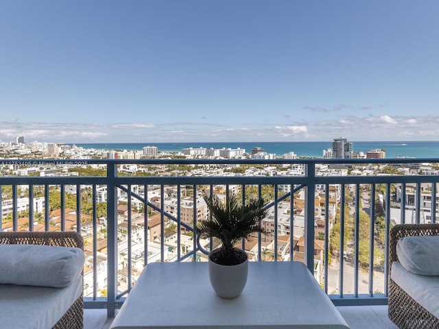 balcony with a water view and a city view