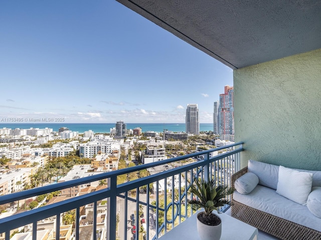 balcony featuring a view of city and a water view