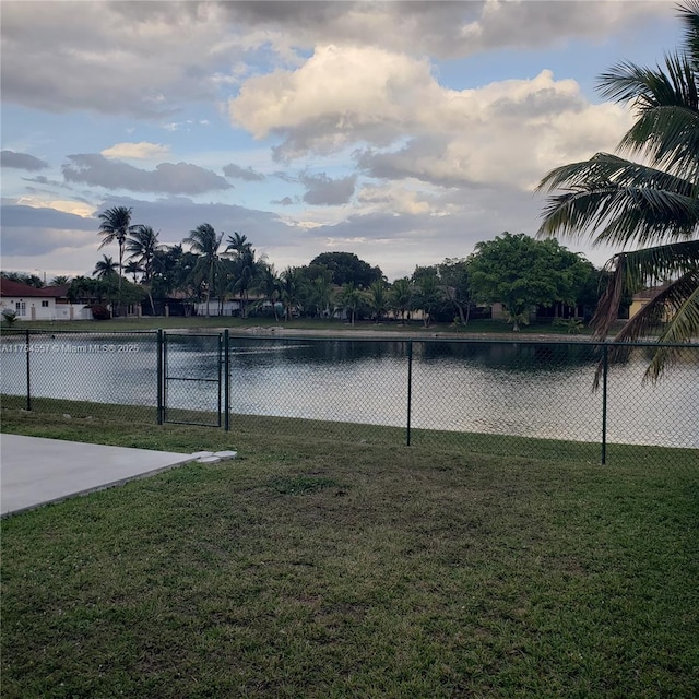 property view of water featuring fence