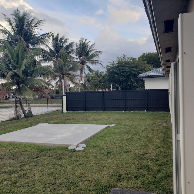 view of yard with a fenced backyard and a patio