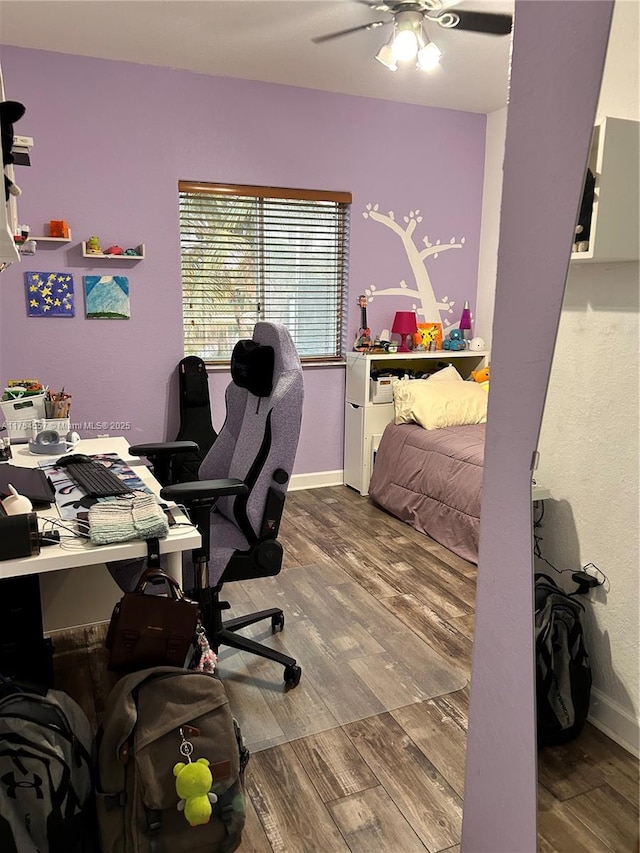 home office with ceiling fan, wood finished floors, and baseboards