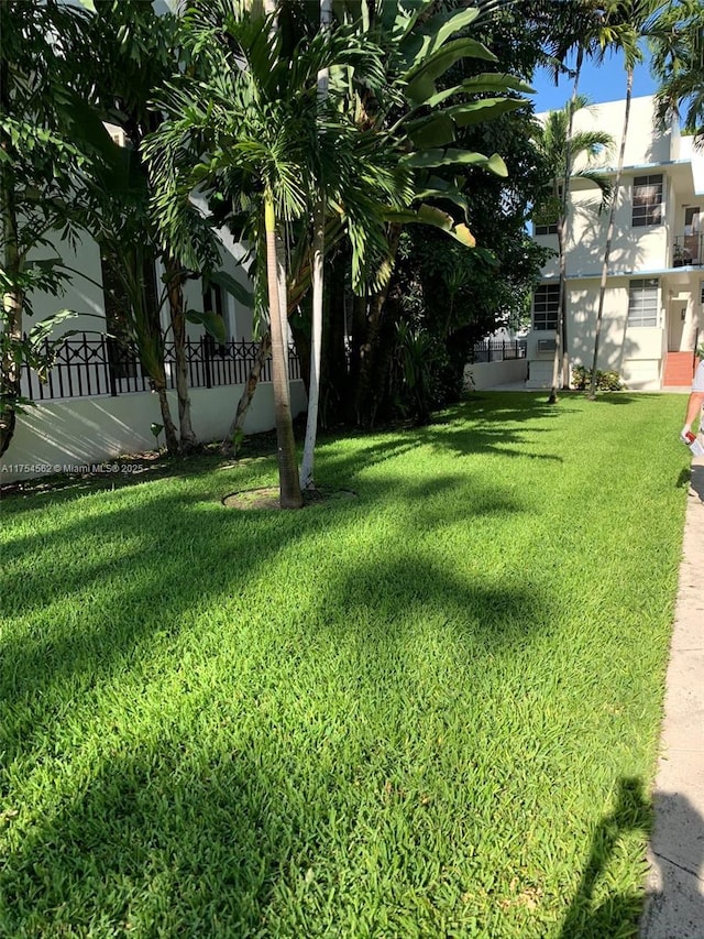 view of yard featuring fence