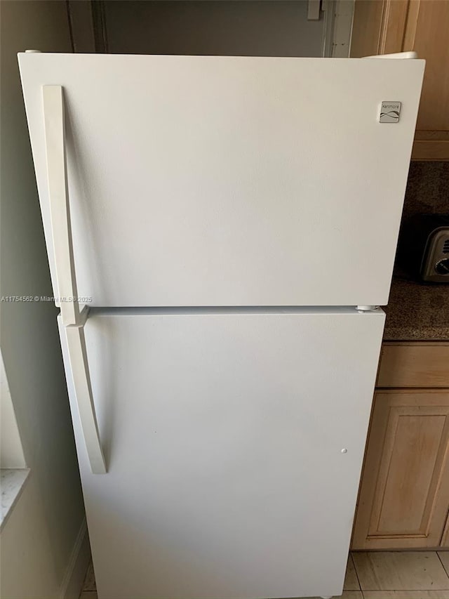 details featuring freestanding refrigerator