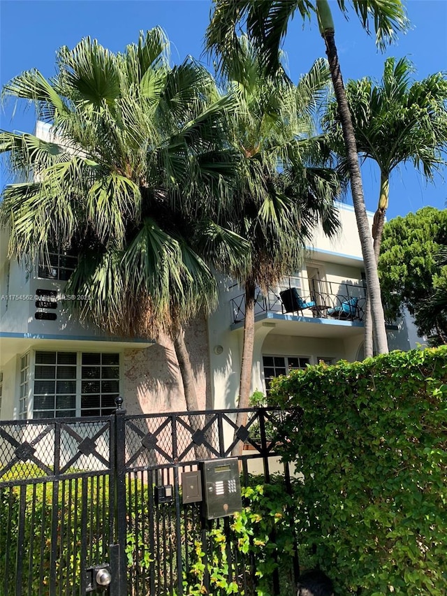 exterior space featuring fence and stucco siding