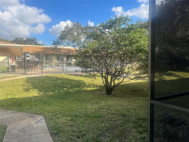 view of yard featuring fence and a gate